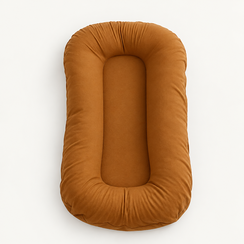 Empty rust-coloured lounger seen from above, showing its padded rim and narrow flat centre 9