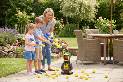 Mother and two young children aiming foam ball poppers at the duck target on a sunny patio 1