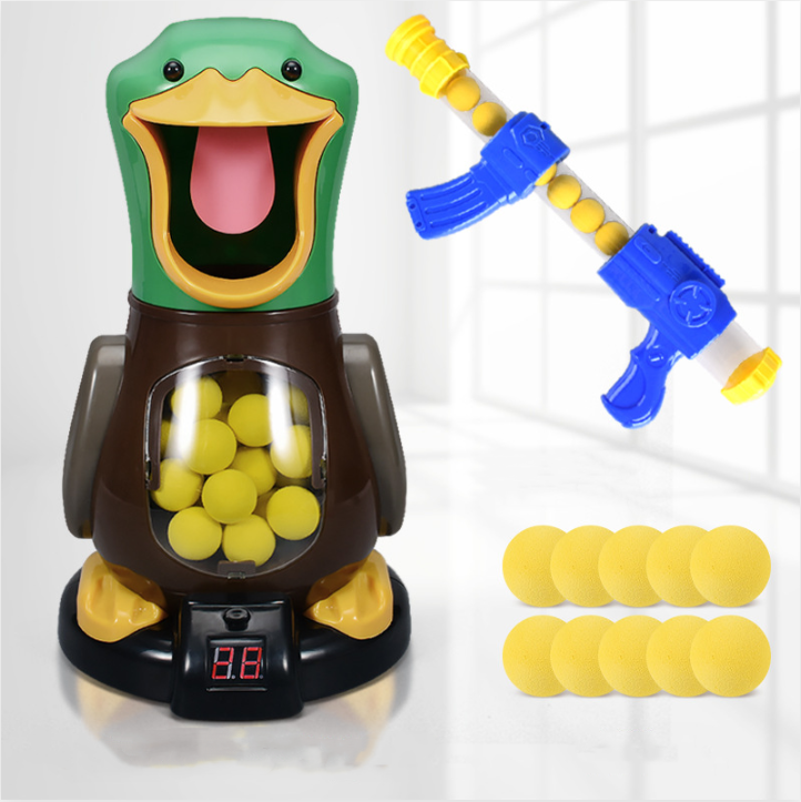 Duck target with one foam-ball gun and ten loose yellow balls arranged beside it 4