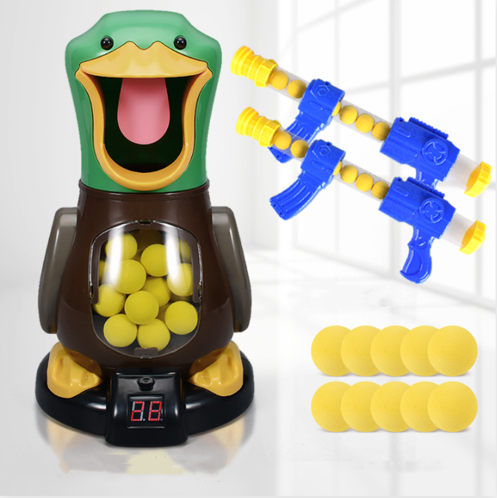 Duck target with two blue and yellow blasters and ten loose yellow foam balls beside it 6