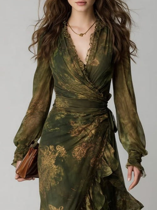Close-up of the upper half, showing the plunging V-neck wrap bodice with ruffle trim, sheer sleeves with ruffled cuffs and side waist tie. 3