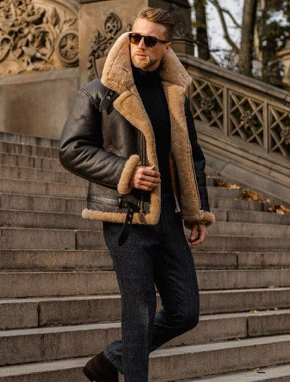 Man in sunglasses wearing the jacket on stone steps, the shearling collar and cuffs turned out 3
