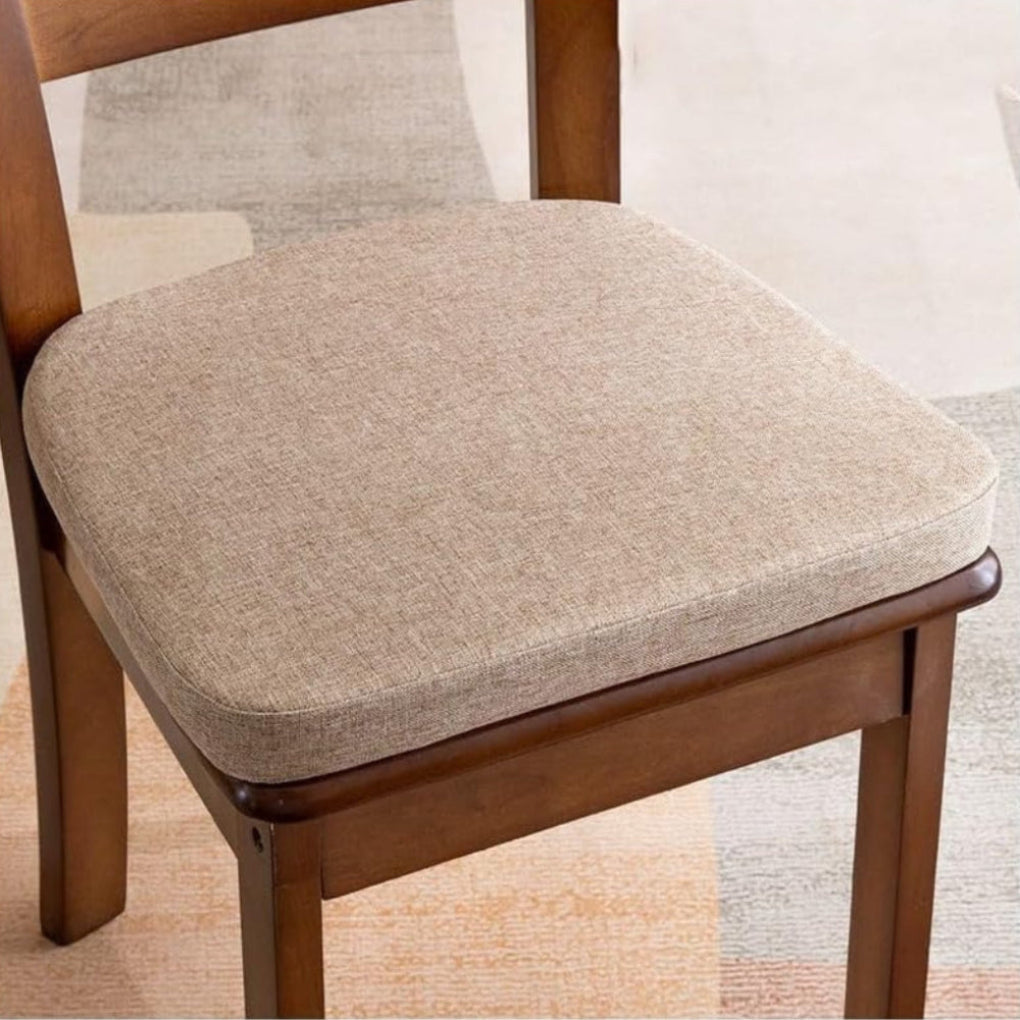 Beige woven-fabric seat cushion with rounded corners, sitting on a dark wooden dining chair 5