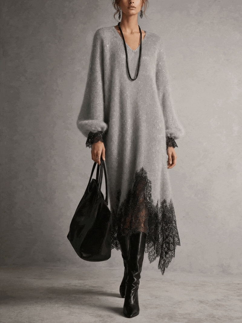 Slightly wider front view of the grey dress on a model against a plain studio wall 2