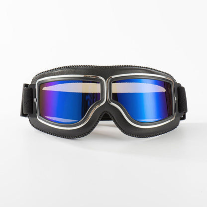 Front view of the black-padded goggles with chrome trim and reflective blue-purple mirrored lenses on a white background. 6
