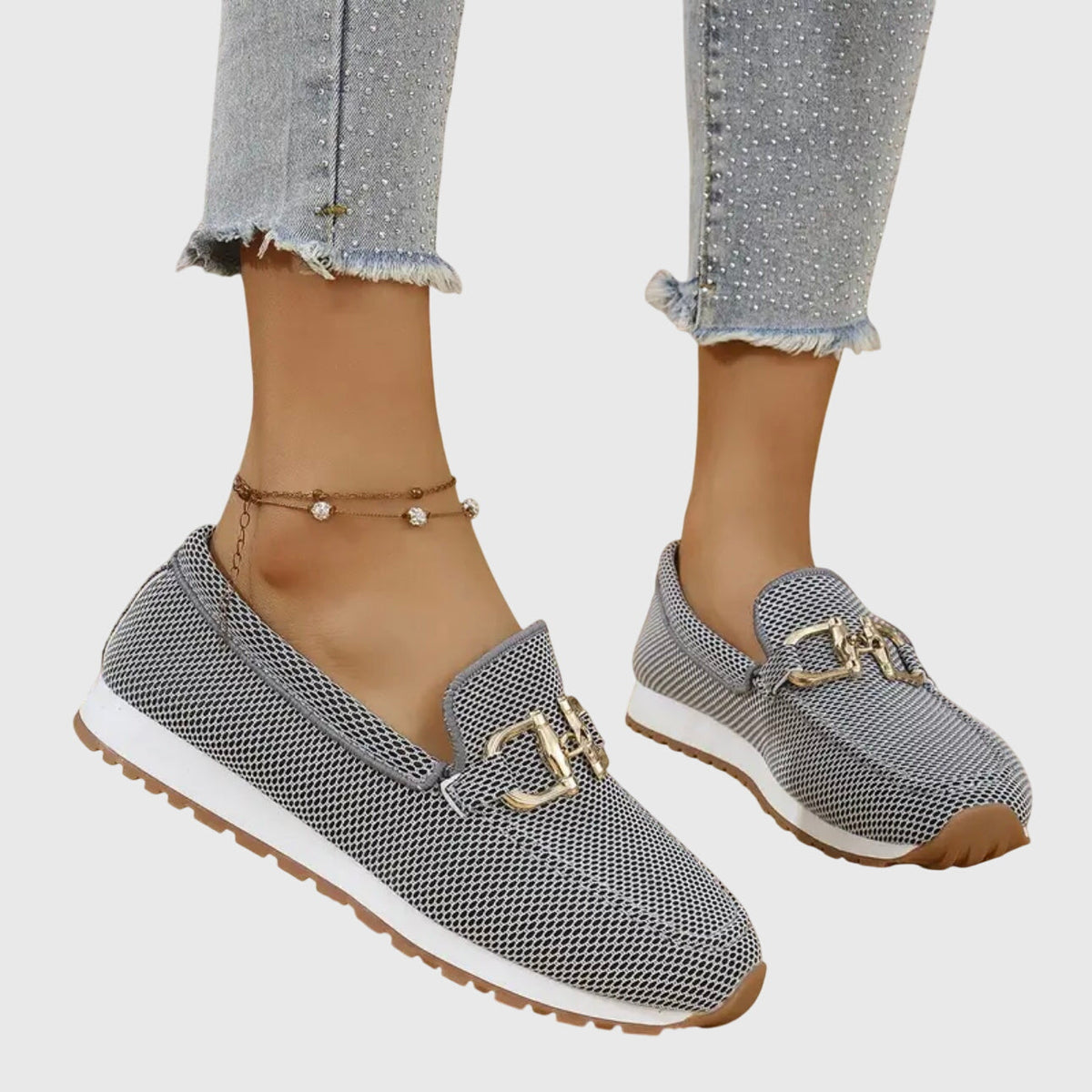 Grey and black mesh loafers with gold buckle, worn from the side with studded cropped jeans 3