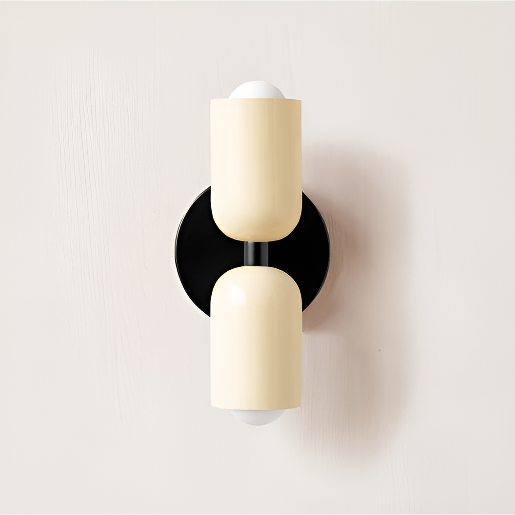 Wall light with both heads in cream on a round black backplate. 36