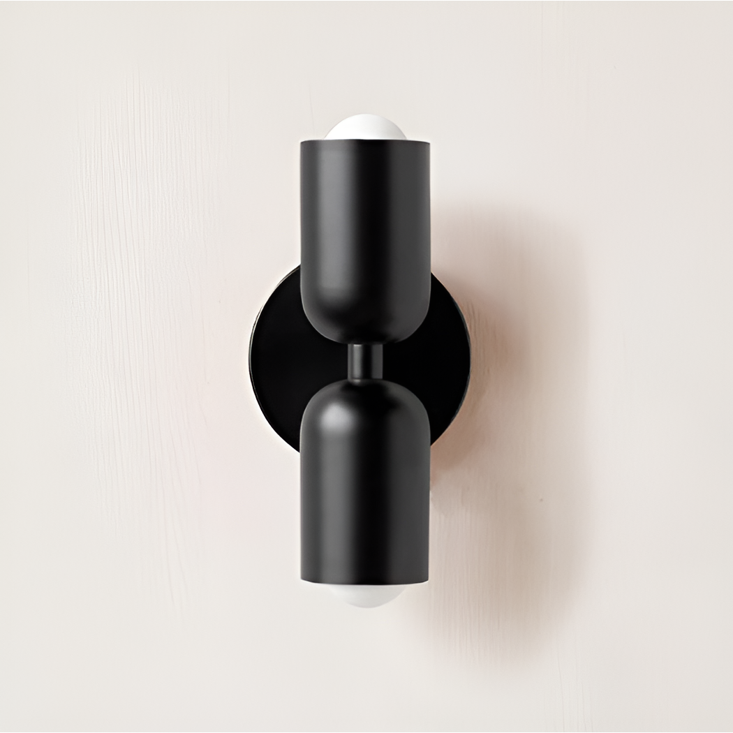 Wall light with both heads and the round backplate in matt black. 27
