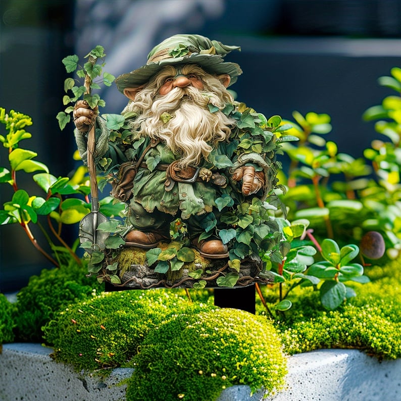 Ivy-clad bearded gnome with a leafy staff, staked into a bed of moss and small green plants. 13