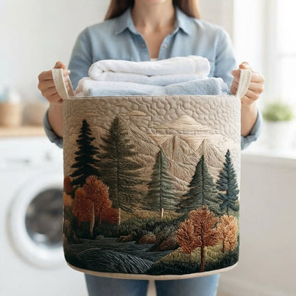 Woman in a blue shirt holding the forest-print basket by its handles, filled with folded white and blue towels in a laundry room. 12
