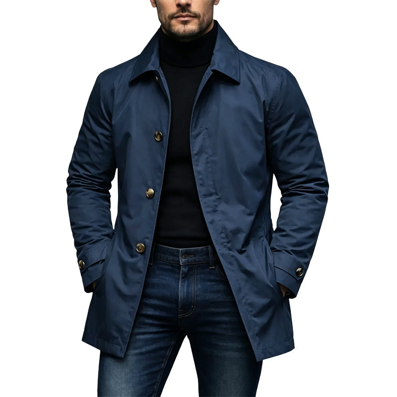 Model wearing the coat in navy blue with brass-toned buttons, over black polo neck and jeans 4