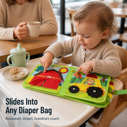Toddler in a high chair at a cafe pressing the barn and windmill pages of the open book, with a beaker and snack nearby. 5