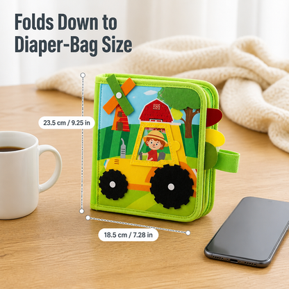 Closed, folded book standing upright on a wooden table with height and width measurements, next to a mug and a phone. 8