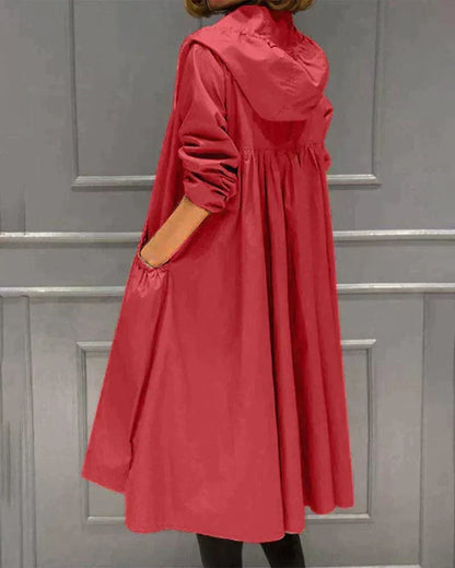 Back and side view of the red hooded raincoat, showing the pleated back, hood and side pocket 5