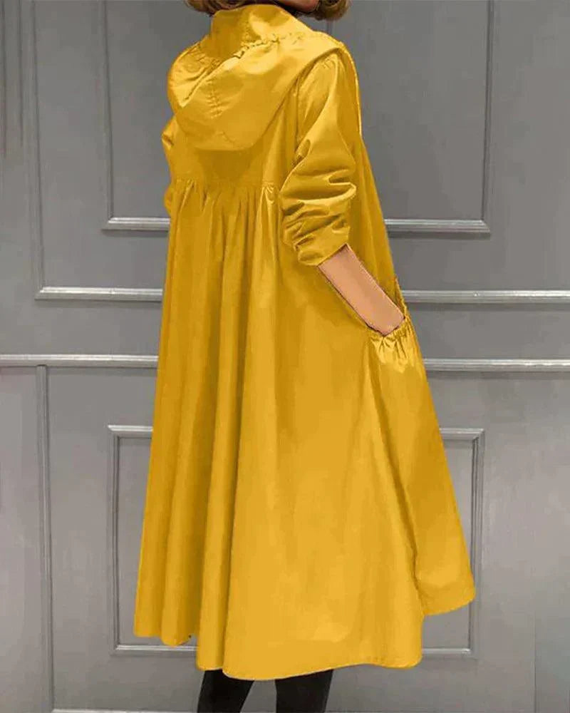 Back and side view of the yellow hooded raincoat, showing the gathered back panel, hood and pocket 7
