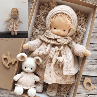 Doll in cream knitted hood, cardigan and floral dress, boxed with a knitted bunny and wooden toys 3