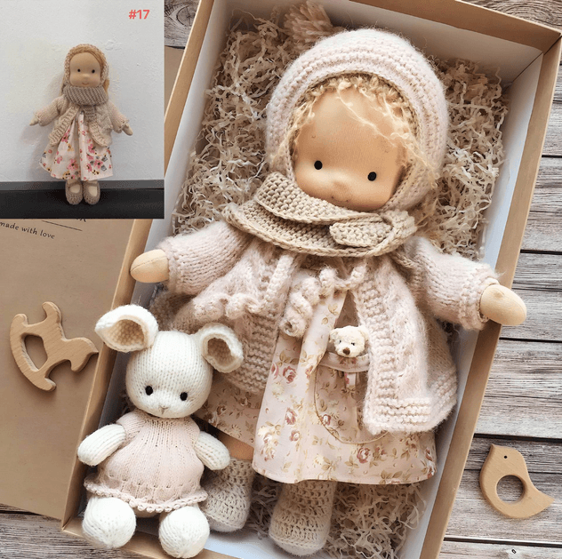 Doll in cream knitted hood, chunky cardigan and floral dress, boxed with a small knitted bunny 3