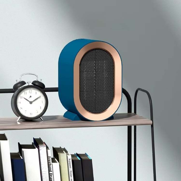 Blue heater with rose-gold rim on a wooden shelf beside an alarm clock and books 1