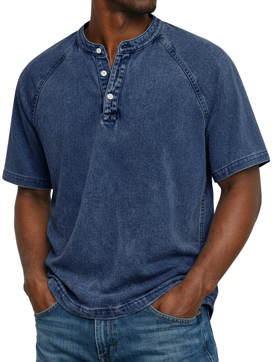 Model wearing the short-sleeved raglan Henley in a washed deep navy blue, showing the button placket and contrast-stitched seams. 3