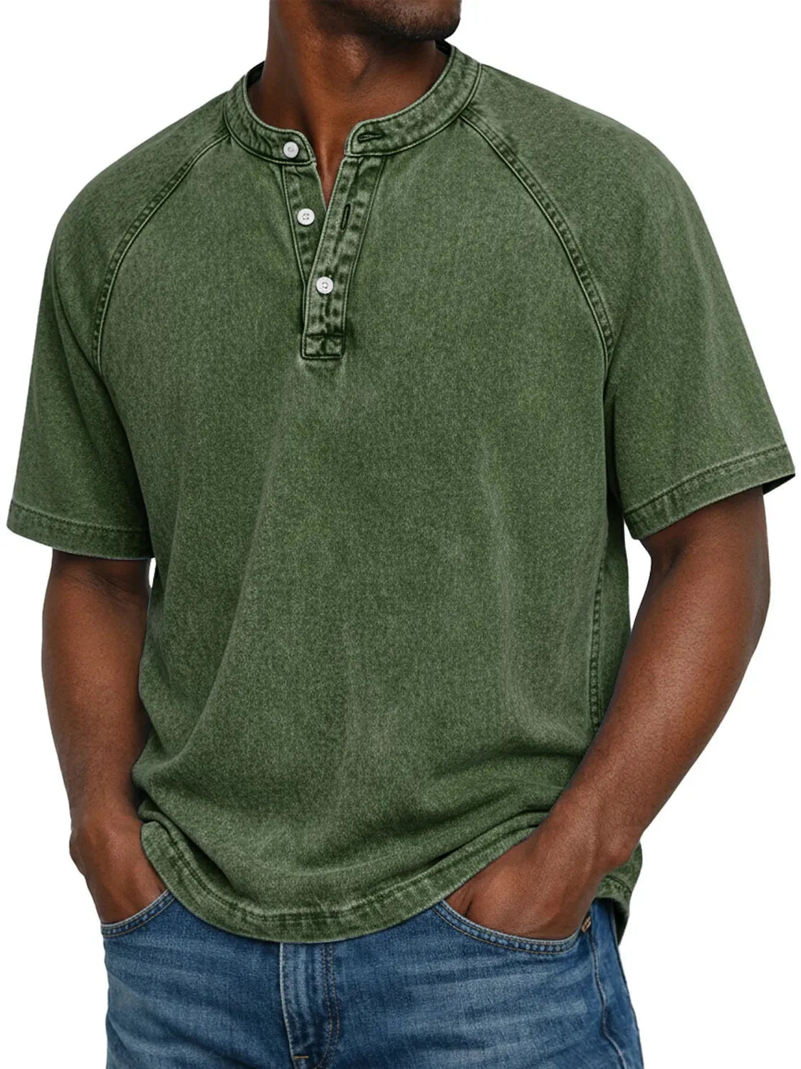 Model wearing the short-sleeved raglan Henley in a washed army green, with the raglan sleeves and button placket in view. 7