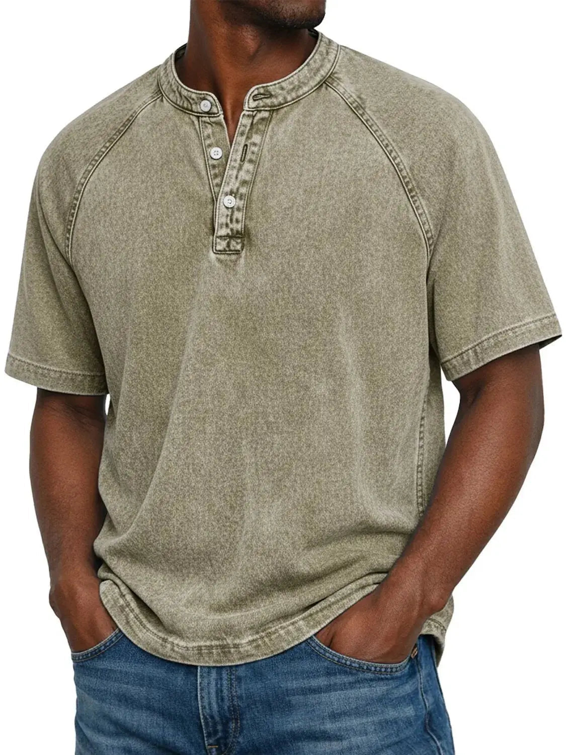 Model wearing the short-sleeved raglan Henley in a washed khaki olive, with the stitched raglan seams and button placket visible. 9