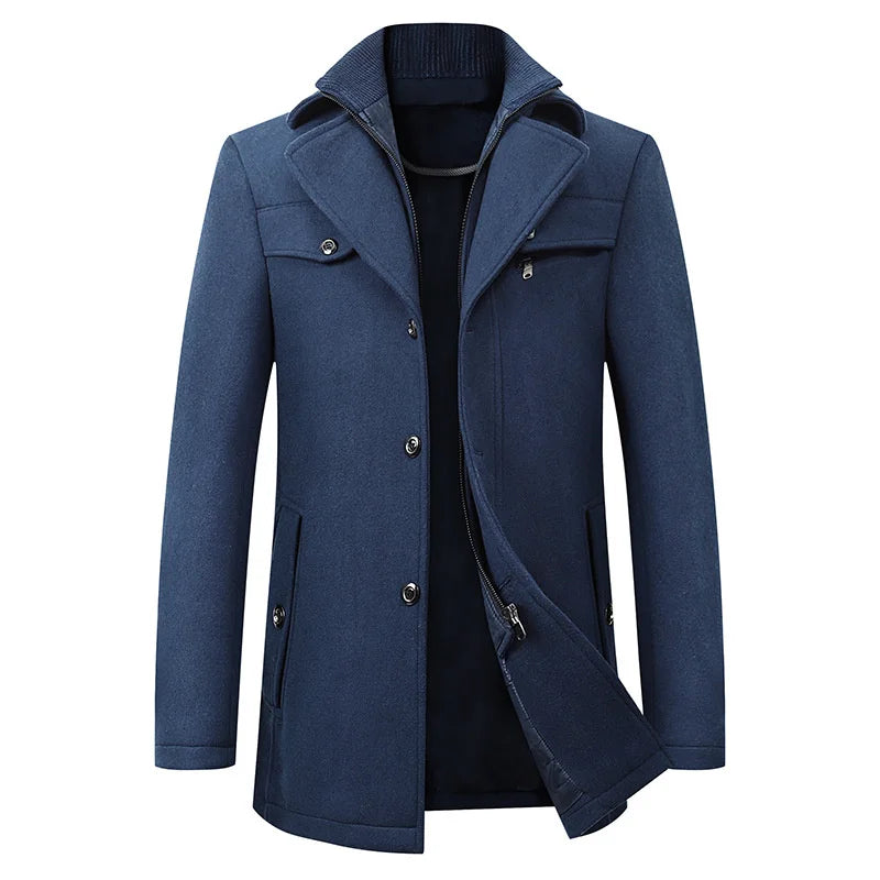 Front view of the blue version, with buttons fastened low and the inner zip layer peeking out beneath the double collar. 3