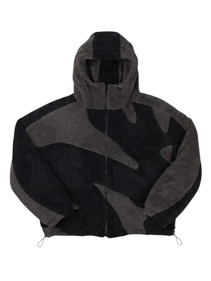 Front view of a zip-up fleece hooded jacket in black and charcoal grey with bold paneled patches and a toggle hem. 1