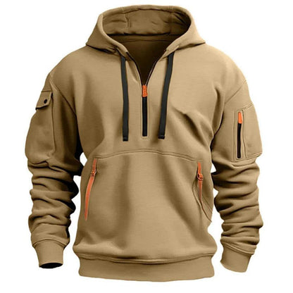 Sand-coloured half-zip hoodie with black drawstrings and orange zip details, shown from the front 2