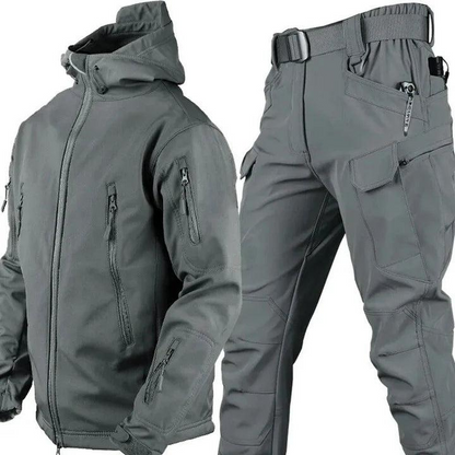 Grey version of the hooded jacket and cargo trousers set, showing zipped chest and sleeve pockets and a flapped thigh pocket. 3
