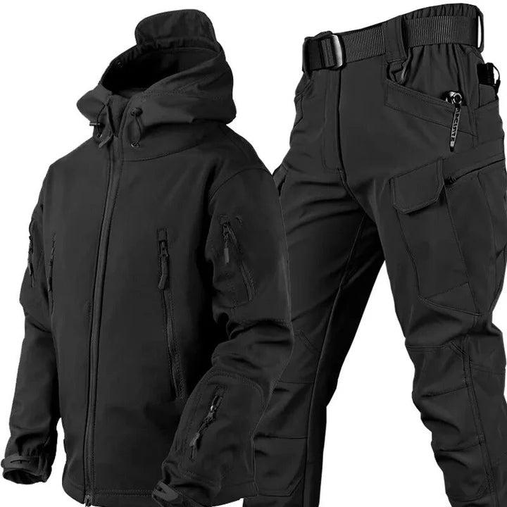 Black version of the hooded jacket and cargo trousers set, with front zip, zipped pockets and belted waist. 4