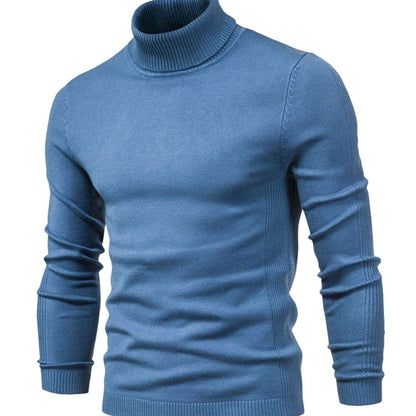 Front view of the long-sleeved turtleneck jumper in mid blue, with ribbed collar, cuffs and hem 3
