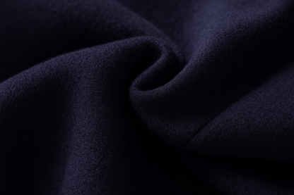 Close-up of soft, brushed navy wool fabric gathered in a gentle fold 11