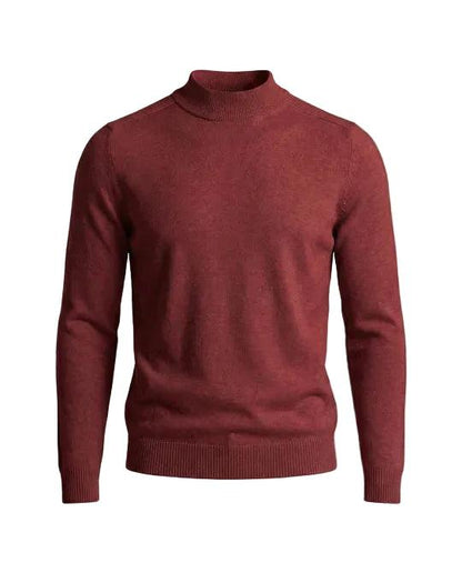 Front view of the jumper in brick red, showing the ribbed stand-up collar, cuffs and hem 8
