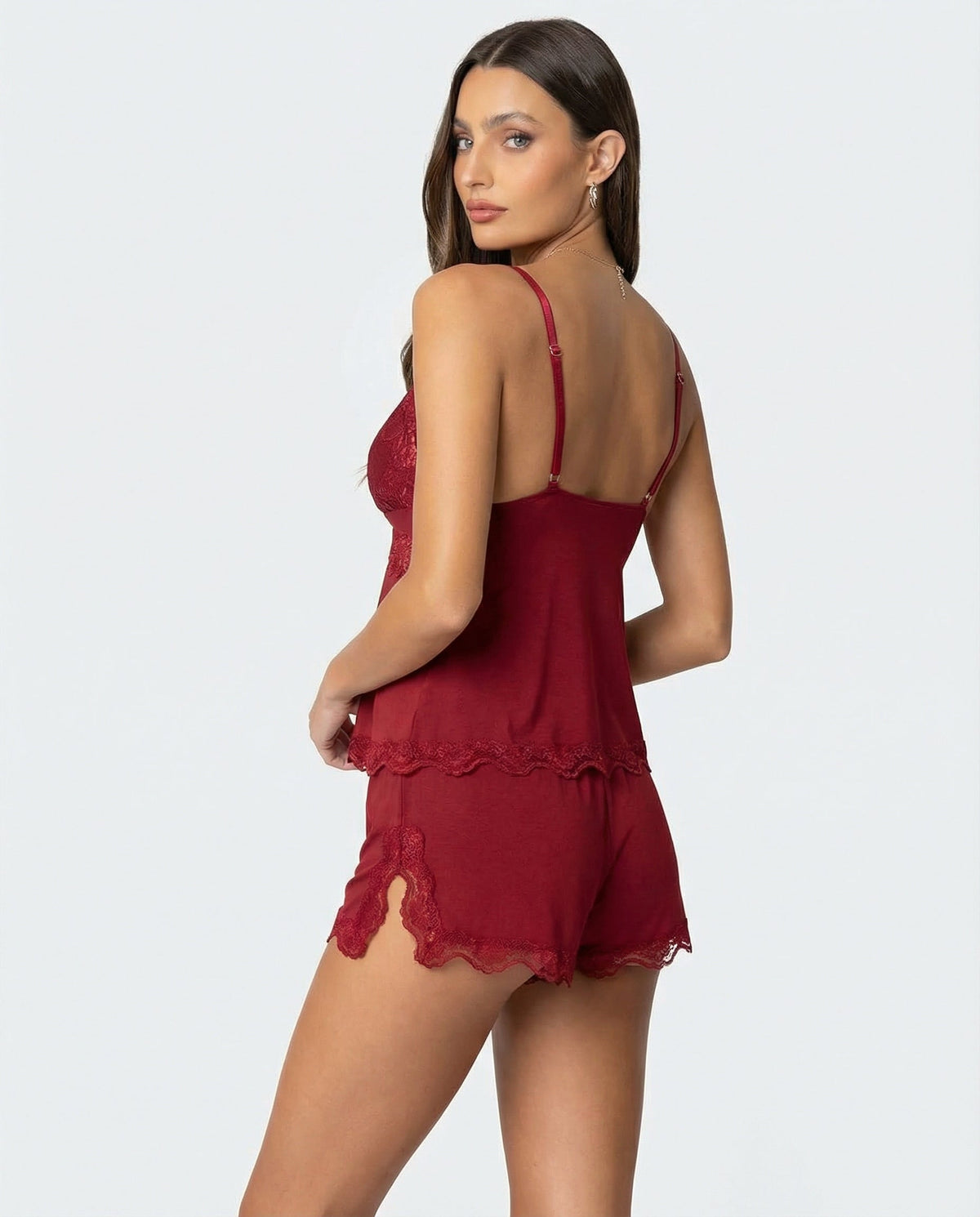 Back view of the burgundy set as the model glances over her shoulder, lace slit on shorts 7