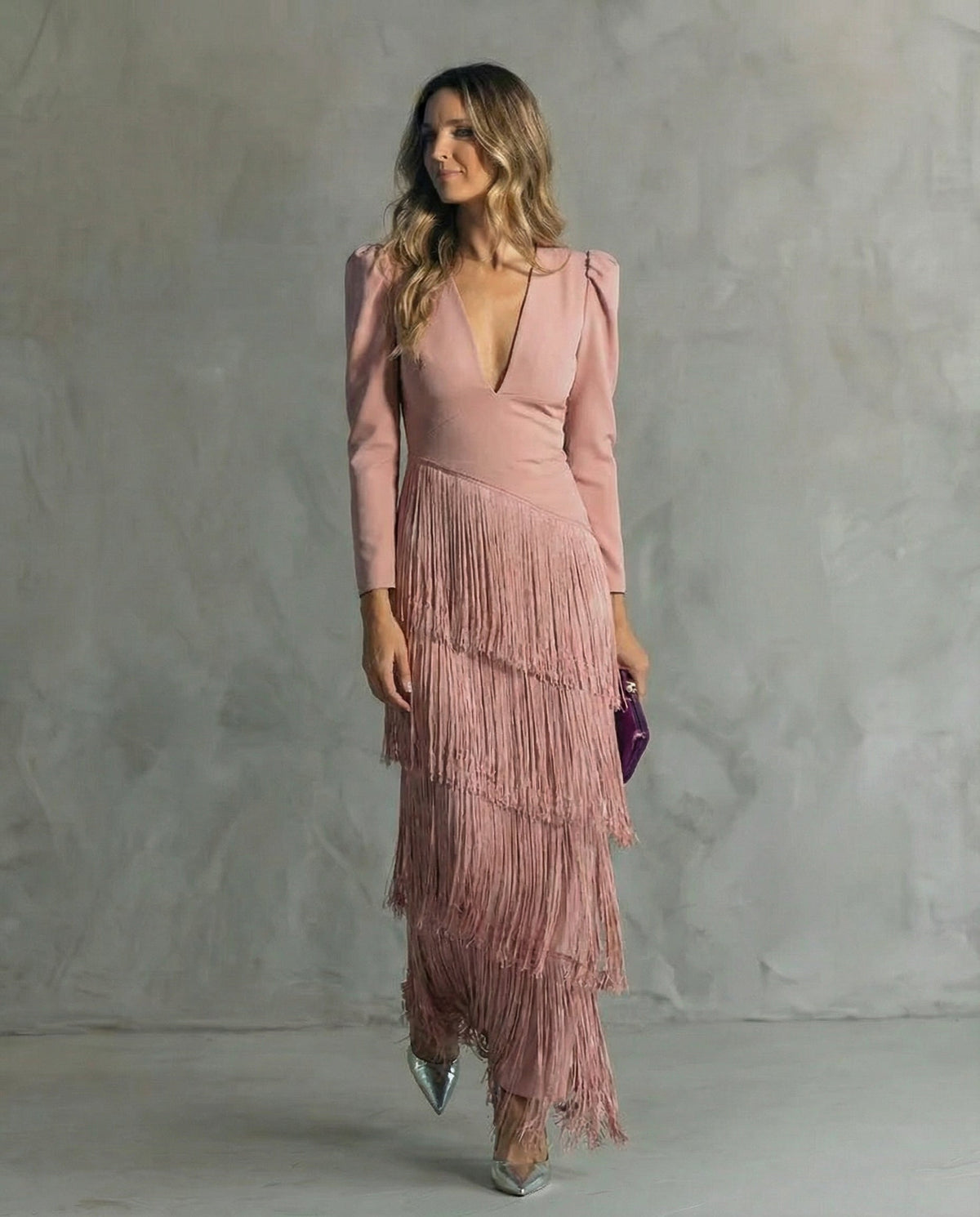 Model wearing the dusty pink fringe dress with a V-neck and layered fringe skirt 7