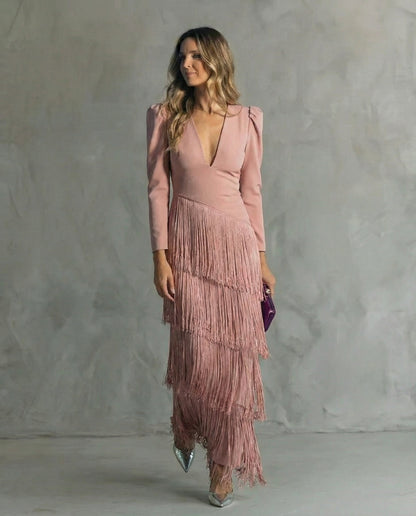 Model wearing the dusty pink fringe dress with a V-neck and layered fringe skirt 7