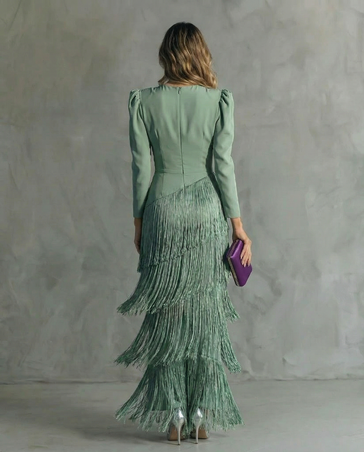 Back view of the sage green dress, showing the zip closure and diagonal seam above the fringe tiers 4