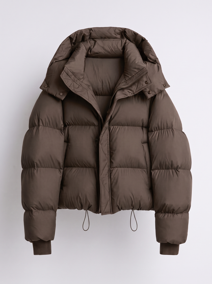 Dark brown quilted puffer jacket laid flat, front view, showing the hood, zip and drawcord hem 2