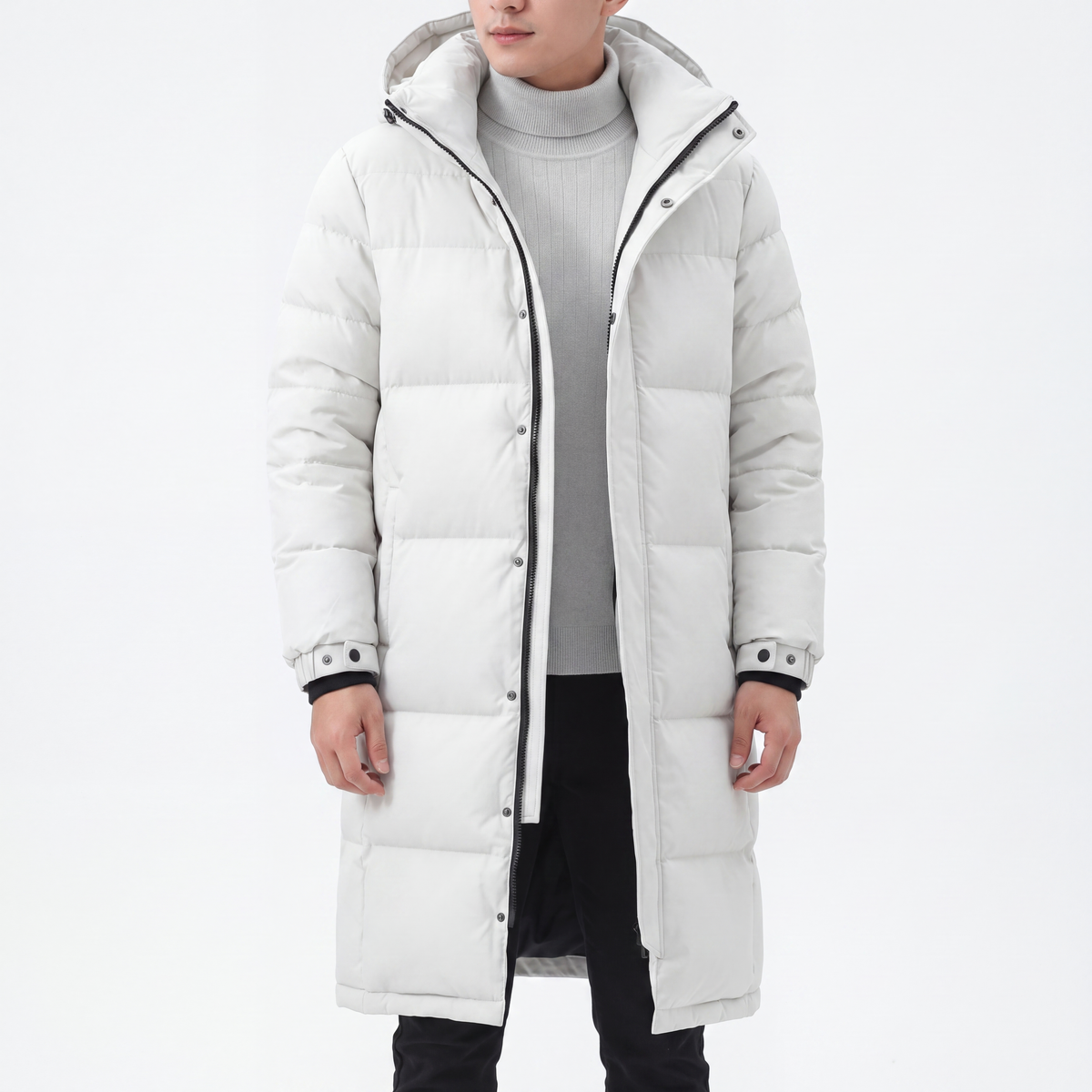 Model wearing the white long hooded puffer coat open over a grey ribbed roll-neck jumper 6