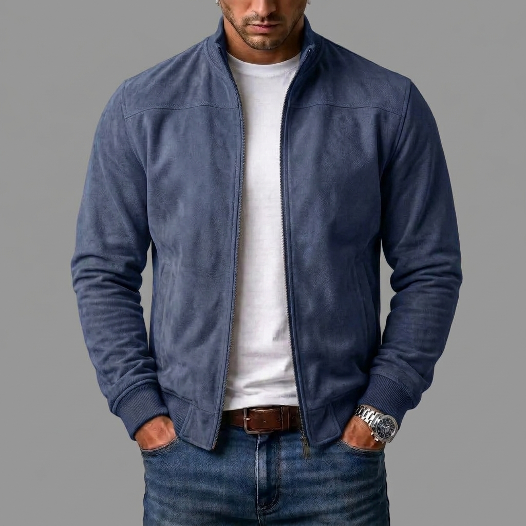 Model wearing the dark navy blue suede-look bomber jacket unzipped over a white t-shirt and jeans, hands in pockets. 5