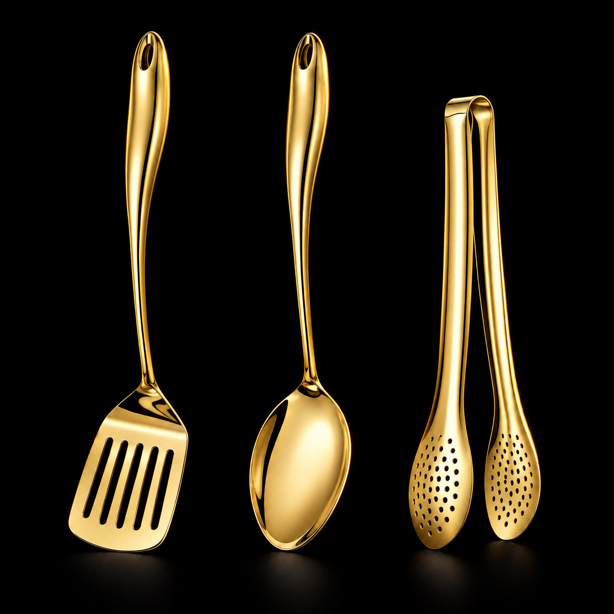 Three-piece set in a gold finish on black: slotted turner, solid spoon and perforated tongs with curved handles. 15