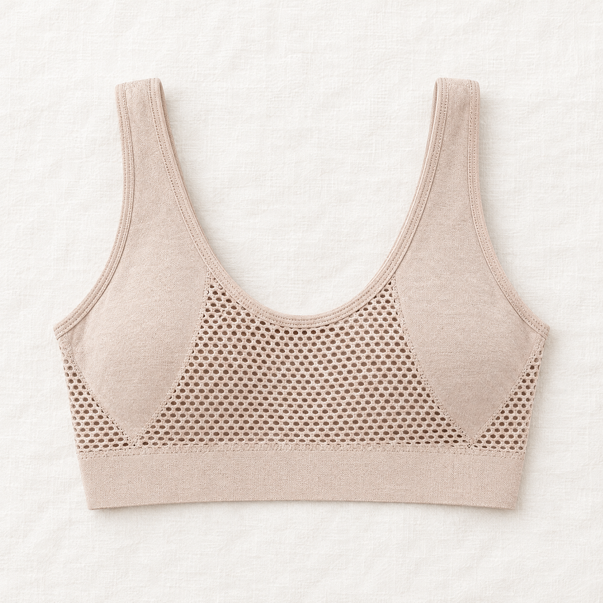 Back of the beige bra laid flat, showing the wide straps and a large honeycomb mesh ventilation panel 8