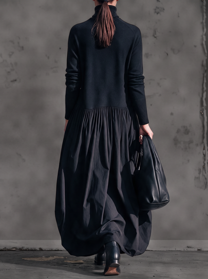 Back view of the black maxi dress, showing the plain mock-neck bodice and full gathered skirt 3
