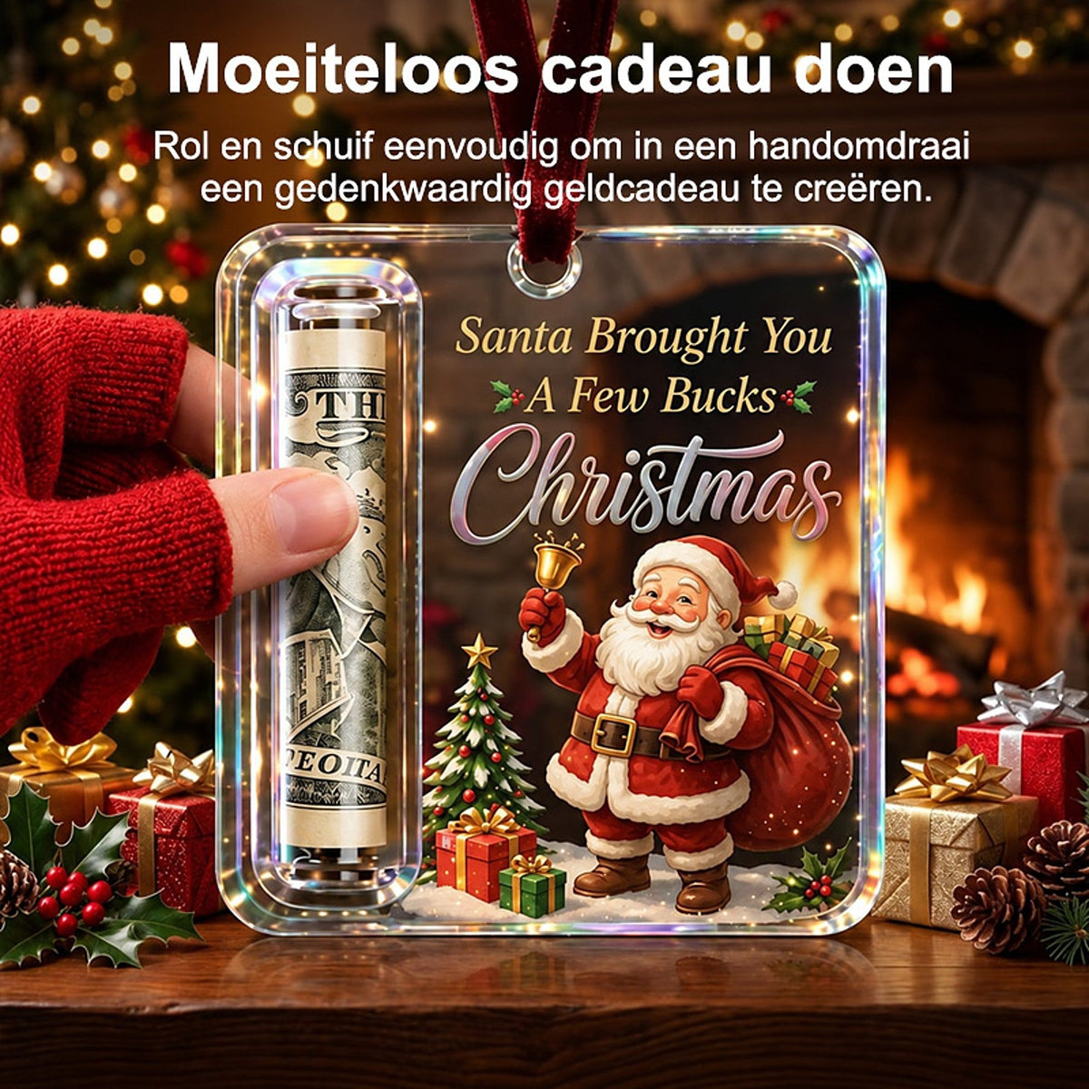 Gloved hand slides a rolled note into the tube slot of the Santa-design ornament, in front of a glowing fireplace. 2