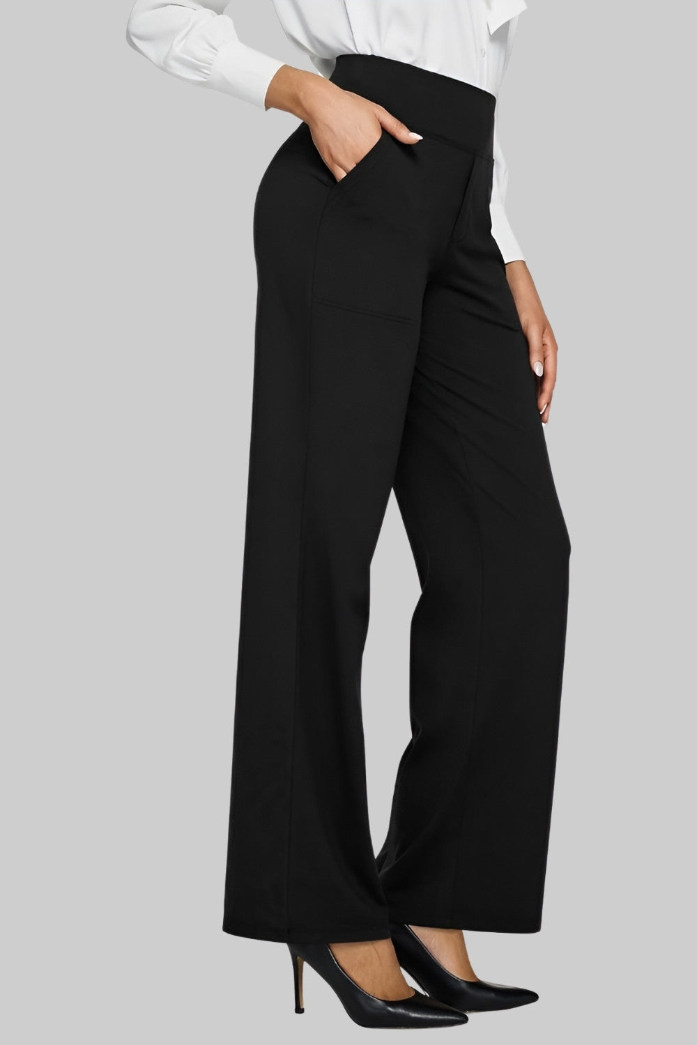 Black trousers styled with a white shirt and black heeled shoes, showing a smarter, office-ready look. 10