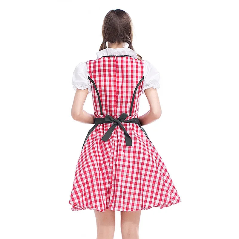 Back view of the red gingham dirndl with ruffled white collar, puff sleeves, back zip and a dark apron tied in a bow. 4