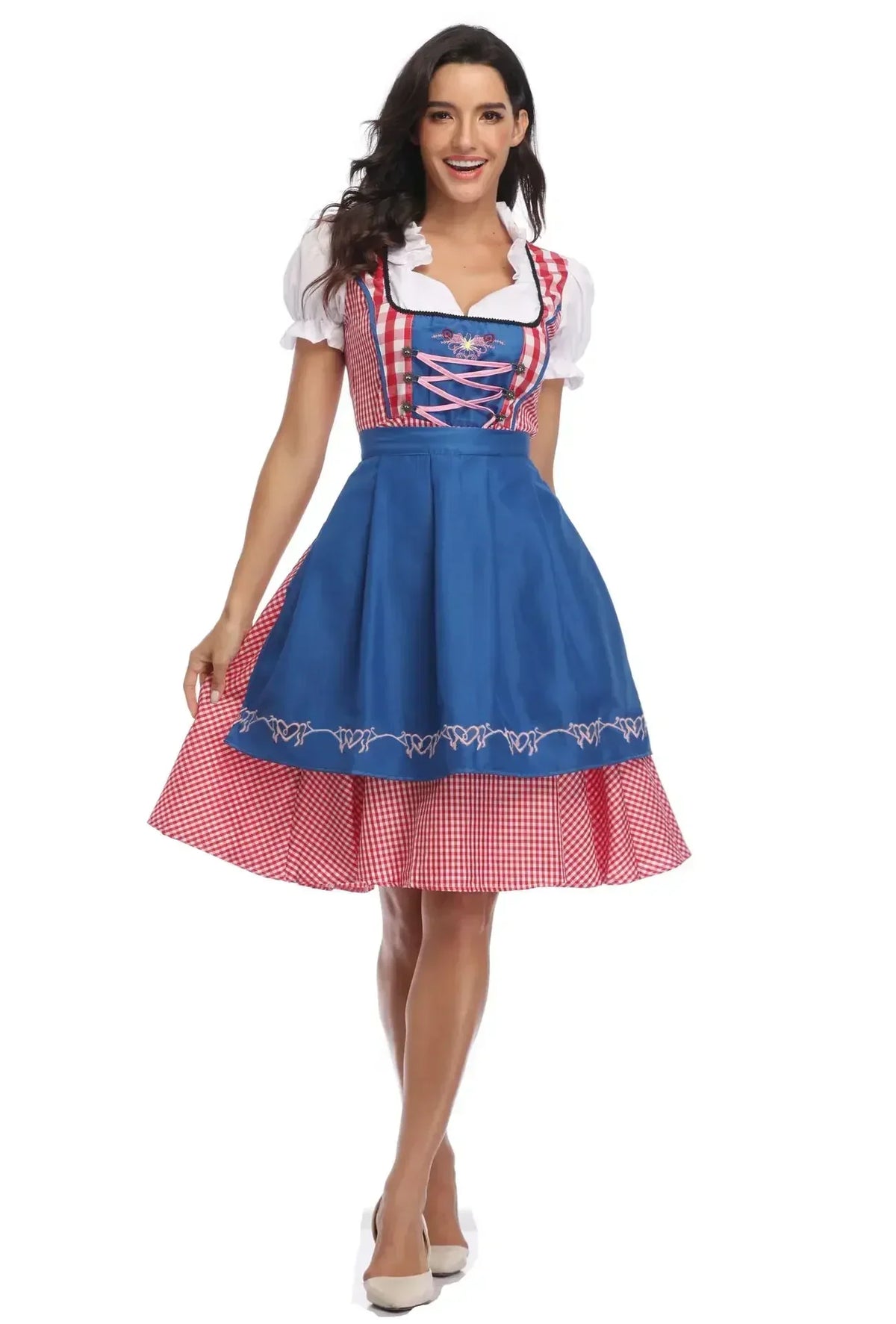 Front view of the red gingham dirndl with pink lacing on a blue bodice and a blue embroidered apron, skirt gently held out. 7