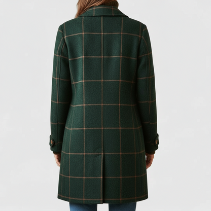 Back view of the green coat showing the orange window-pane check, centre vent and buttoned cuff tabs on the sleeves. 2