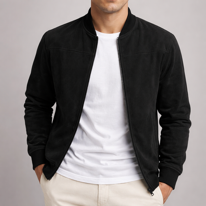 Model wearing the jacket in black, unzipped over a white t-shirt, with ribbed collar and cuffs and hands in pockets. 5