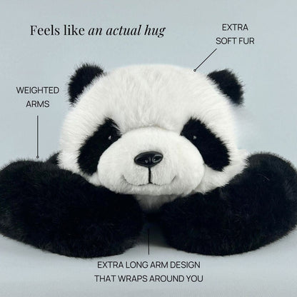 Close front view of the panda plush resting its head on its long, weighted black arms, with callouts pointing to its features. 5